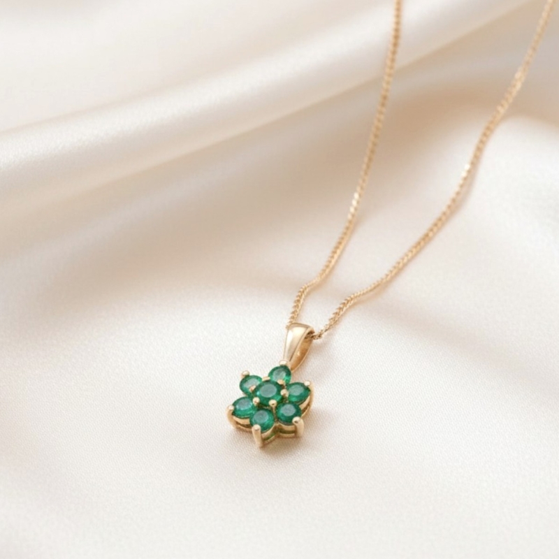 vintage style 9ct gold and emerald cluster pendant on a gold chain for sale in Leeds