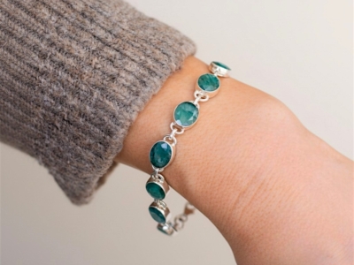 modern silver and emerald bracelet on wrist for sale in Leeds