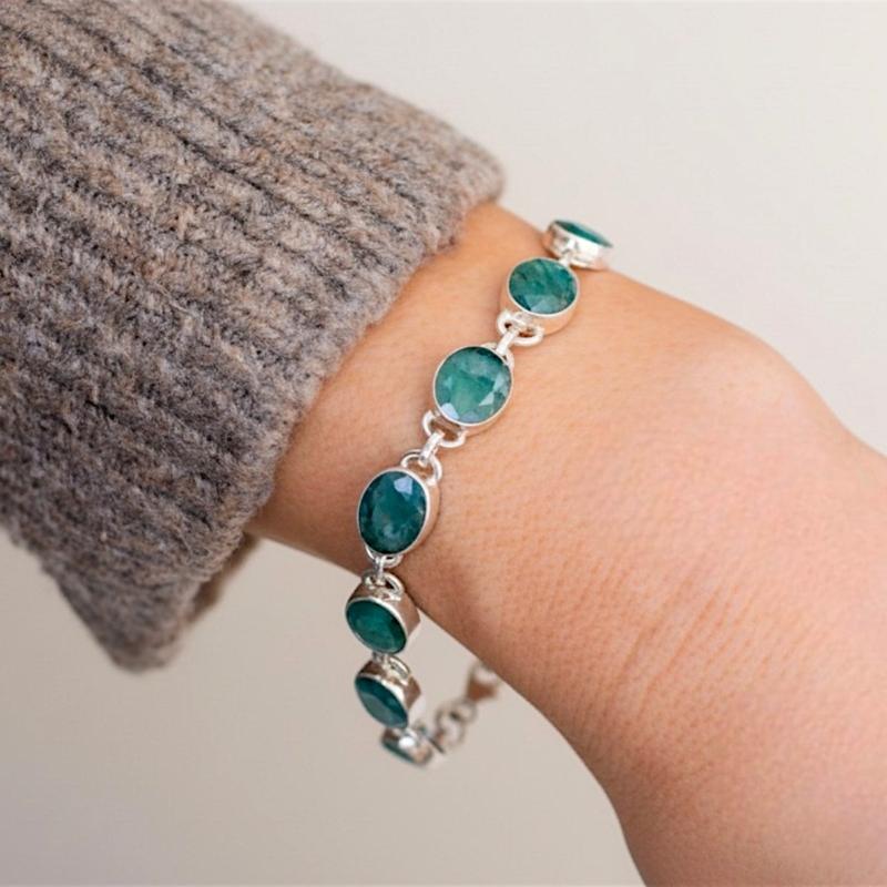 modern silver and emerald bracelet on wrist for sale in Leeds
