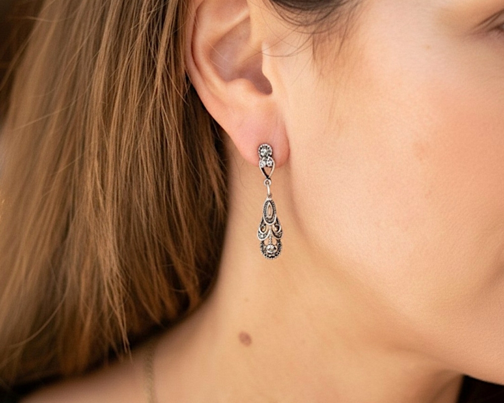 vintage style silver and marcasite drop earrings for pierced ears for sale in Leeds in model's ear