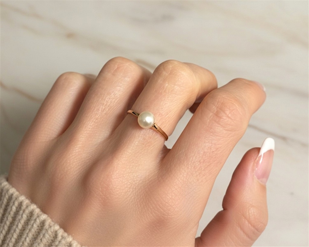 vintage pearl ring in 18ct yellow gold shown on a model's hand