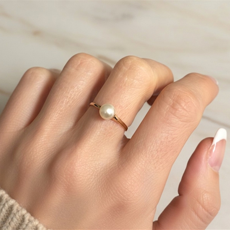 vintage pearl ring in 18ct yellow gold shown on a model's hand