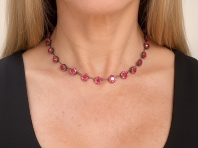 1920s pink paste and silver choker necklace on model's neck for sale in Leeds, UK