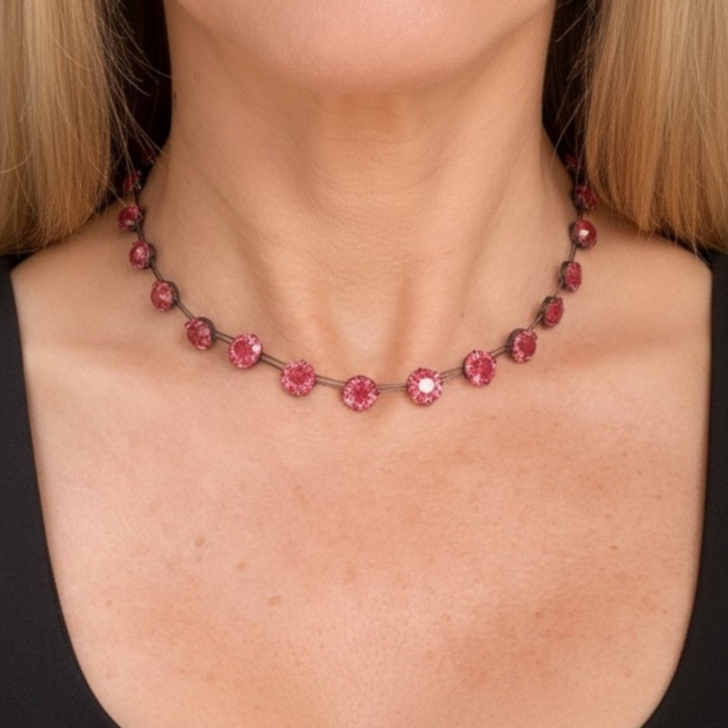 1920s pink paste and silver choker necklace on model's neck for sale in Leeds, UK