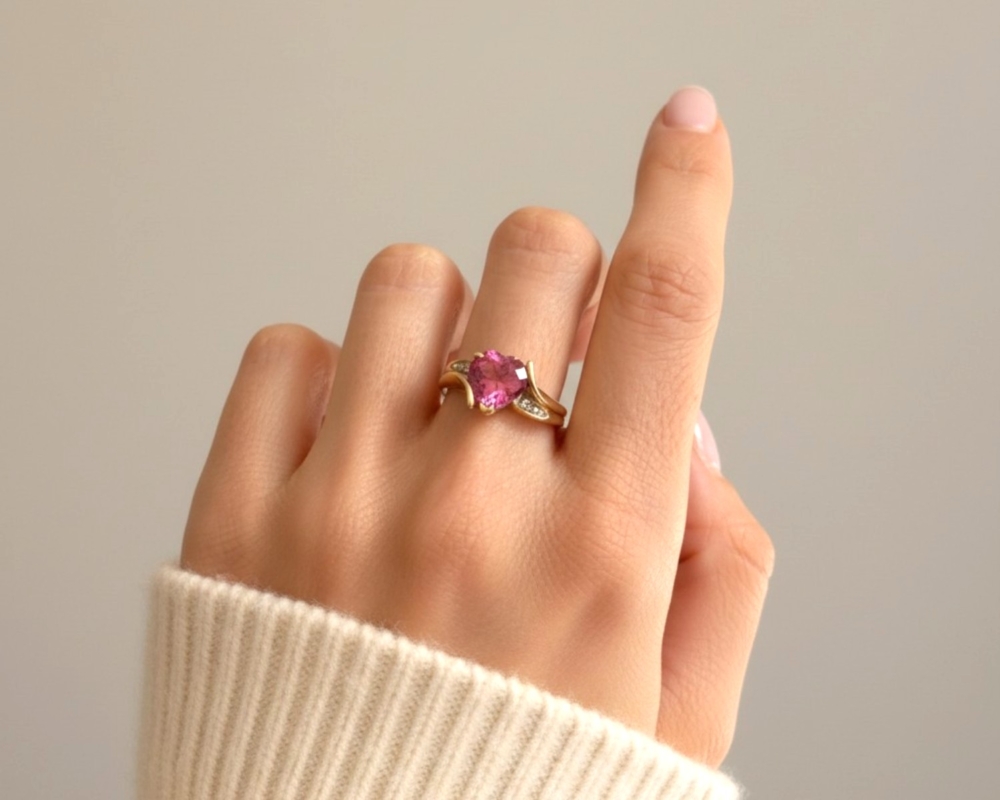 vintage pink topaz and diamond heart ring in 9ct gold for sale in Leeds UK, on model's hand