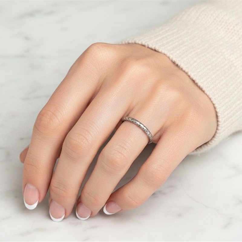 antique 1930s platinum engraved wedding ring for sale in Leeds, UK shown here on a model's hand