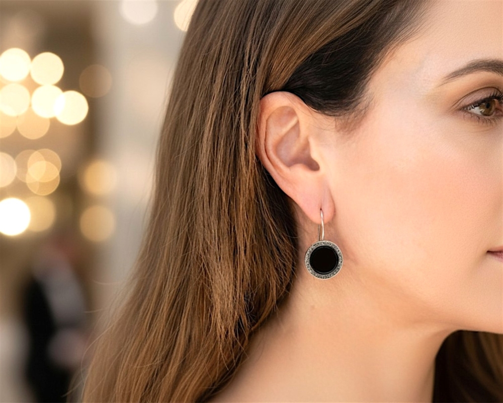 art deco style round onyx earrings in silver with marcasite stones for sale in Leeds on model