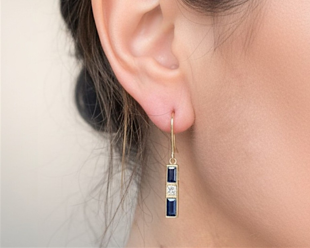 vintage sapphire and diamond drop earrings in 14ct gold in model's ear