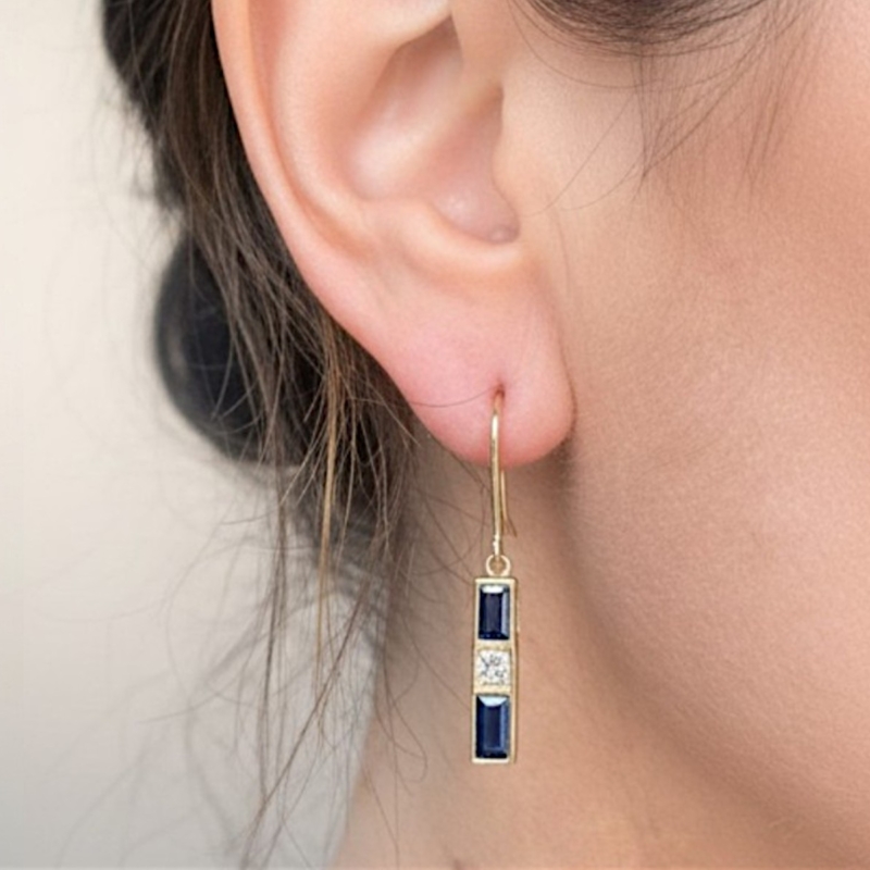vintage sapphire and diamond drop earrings in 14ct gold in model's ear