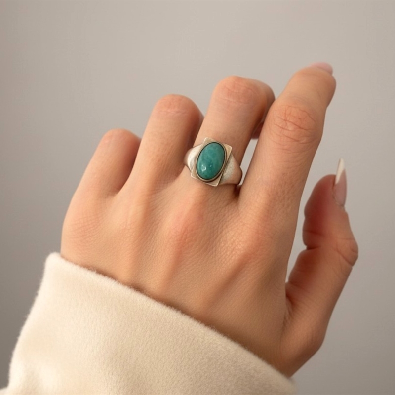 Antique Georg Jensen silver and turquoise ring circa 1920s for sale in Leeds, UK, on model's hand