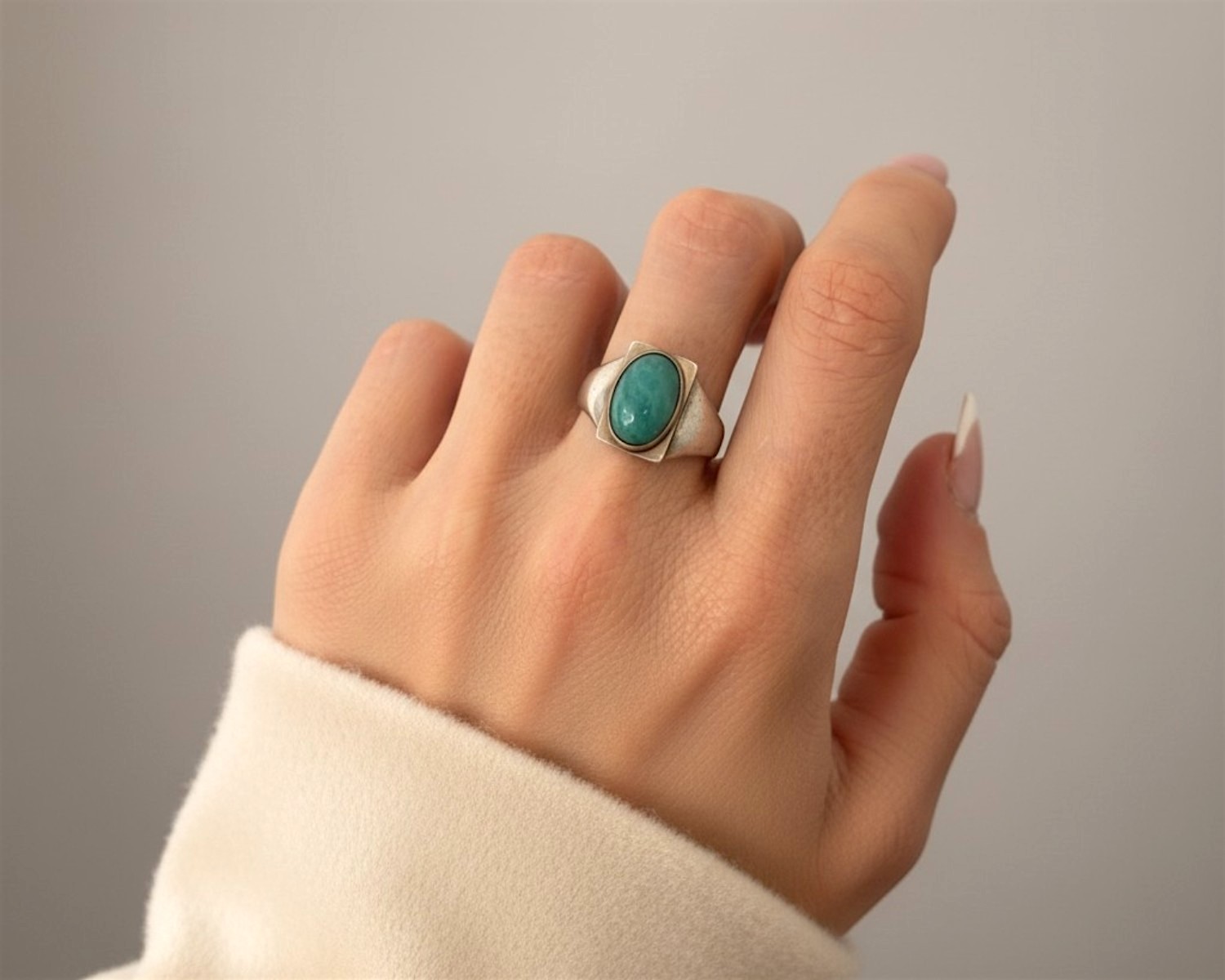 turquoise ring on hand