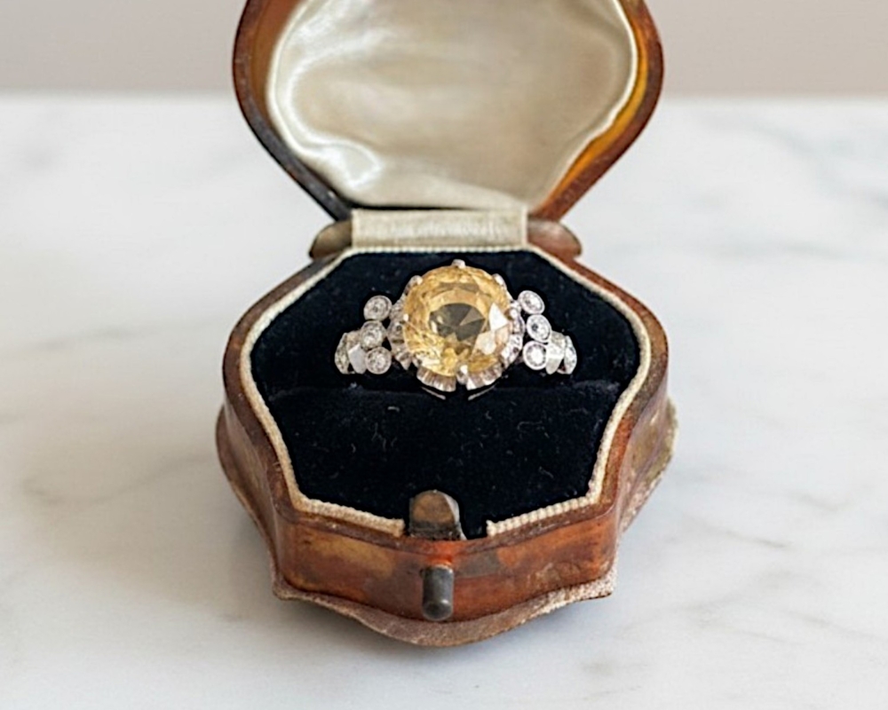 Antique 1930s yellow sapphire and diamond ring with a 6ct yellow sapphire centtre stone in platinum. For sale in Leeds, UK in antique ring box
