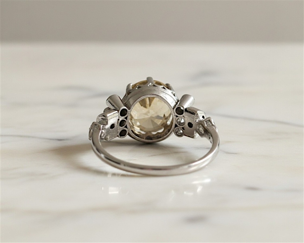 Antique 1930s yellow sapphire and diamond ring with a 6ct yellow sapphire centtre stone in platinum. For sale in Leeds, UK in antique ring box, showing back view