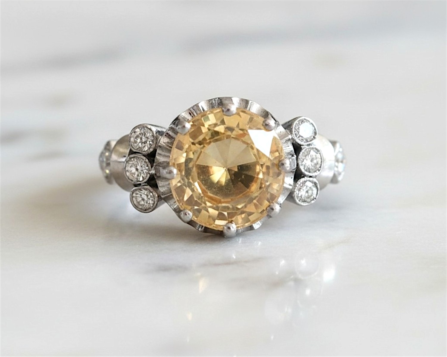 Antique 1930s yellow sapphire and diamond ring with a 6ct yellow sapphire centtre stone in platinum. For sale in Leeds, UK