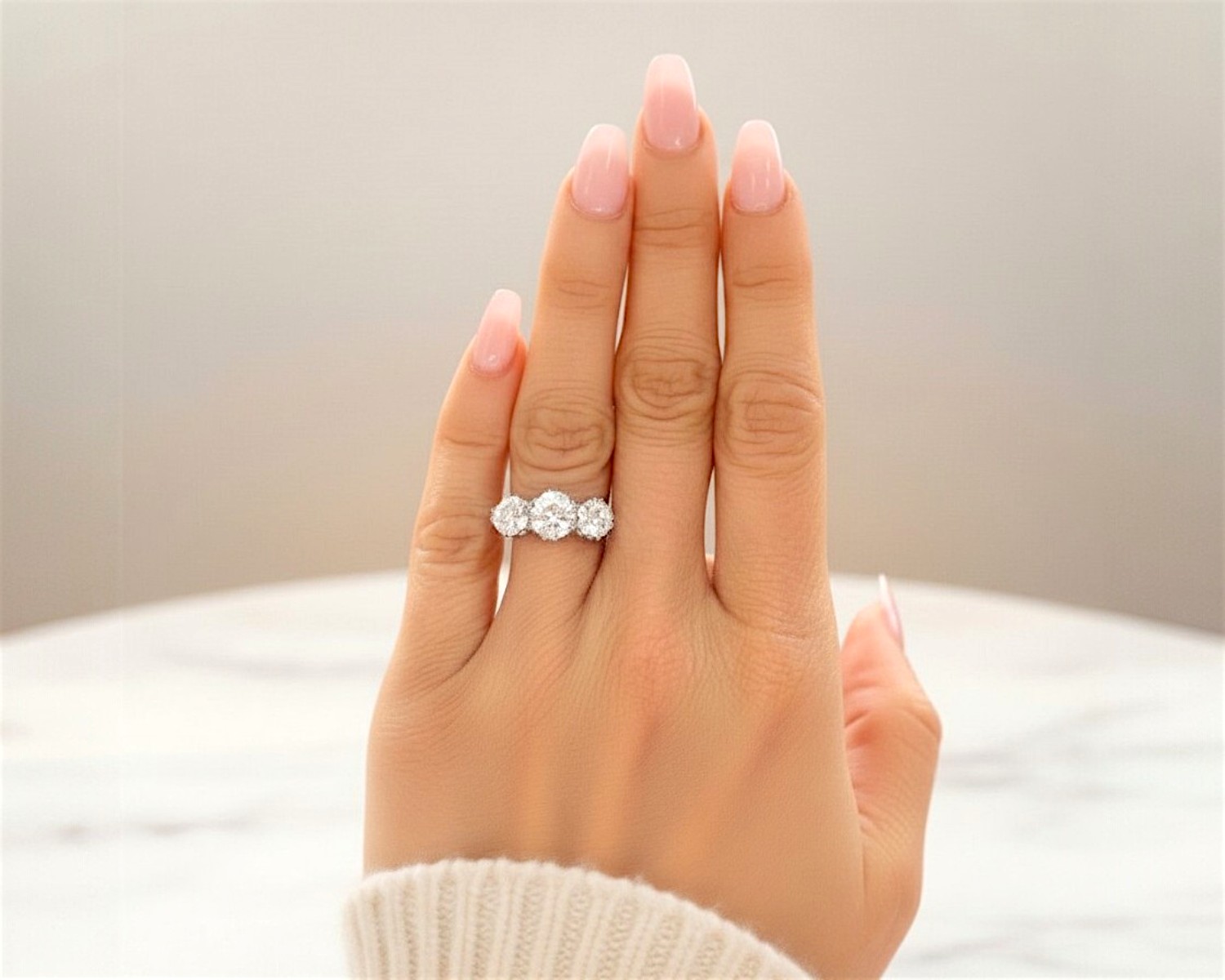 4.5ct diamond three stone ring on hand