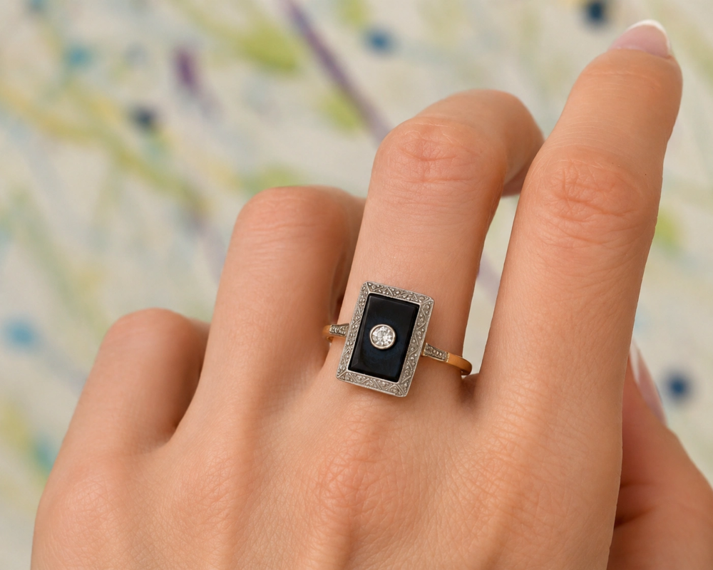Art deco onyx and diamond panel ring in 18ct gold for sale in Leeds shown on model's hand