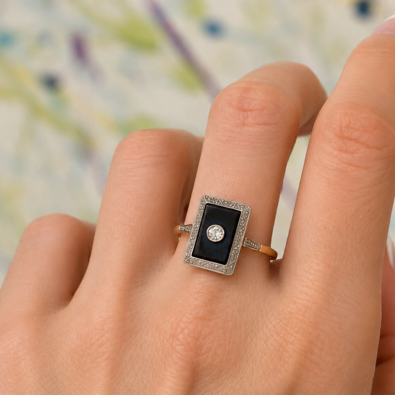 Art deco onyx and diamond panel ring in 18ct gold for sale in Leeds shown on model's hand