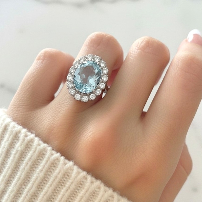 Art deco aquamarine and diamond cluster ring in 18ct yellow gold and platinum with 5.36ct aqua in Leeds, UK, shown on woman's hand