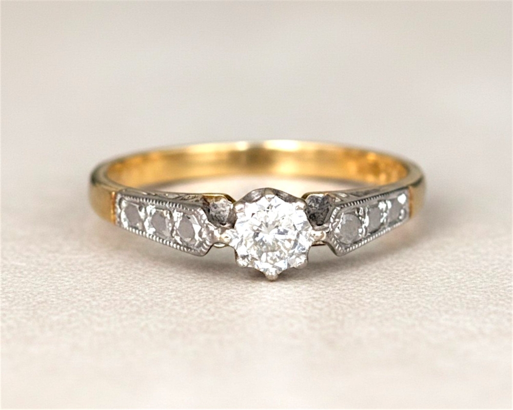 vintage diamond solitaire ring with illusion setting in 18ct yellow gold and platinum. For sale in Leeds