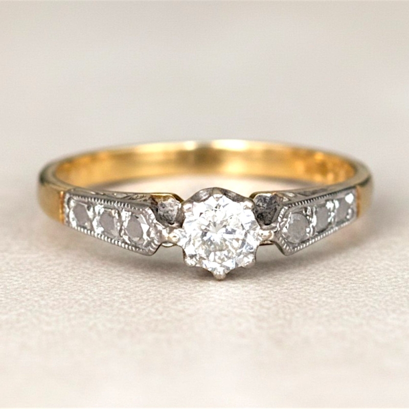 vintage diamond solitaire ring with illusion setting in 18ct yellow gold and platinum. For sale in Leeds