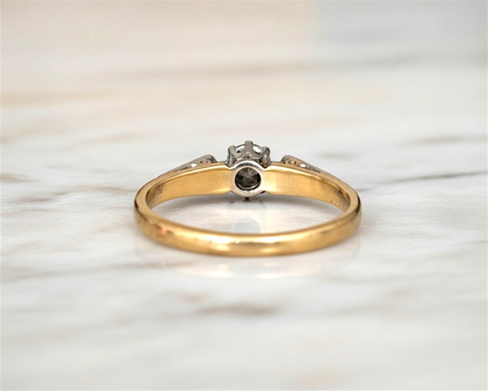 vintage diamond solitaire ring with illusion setting in 18ct yellow gold and platinum. For sale in Leeds showing rear view