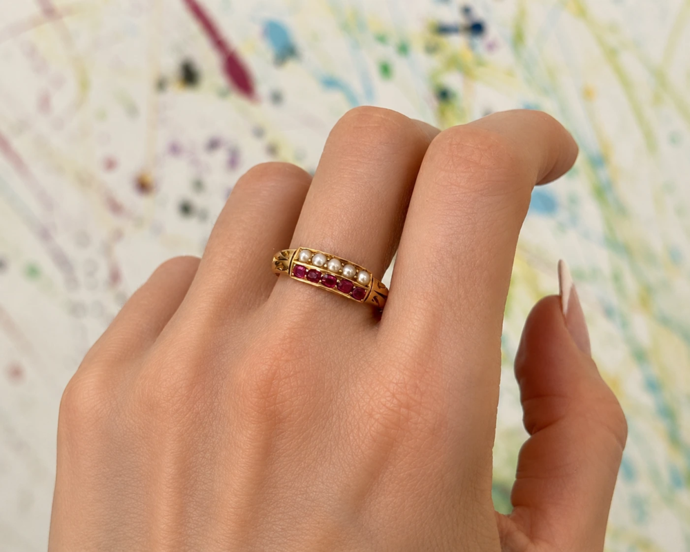 Victorian ruby and pearl ring in 18ct gold for sale in Leeds, shown on model's finger