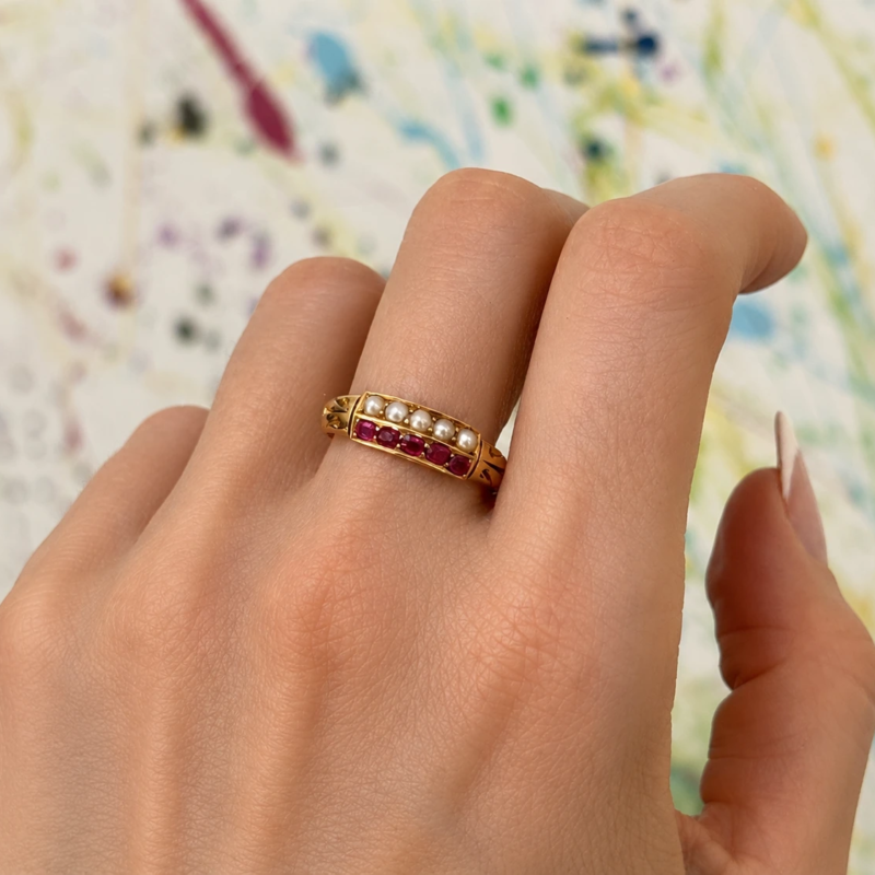 Victorian ruby and pearl ring in 18ct gold for sale in Leeds, shown on model's finger