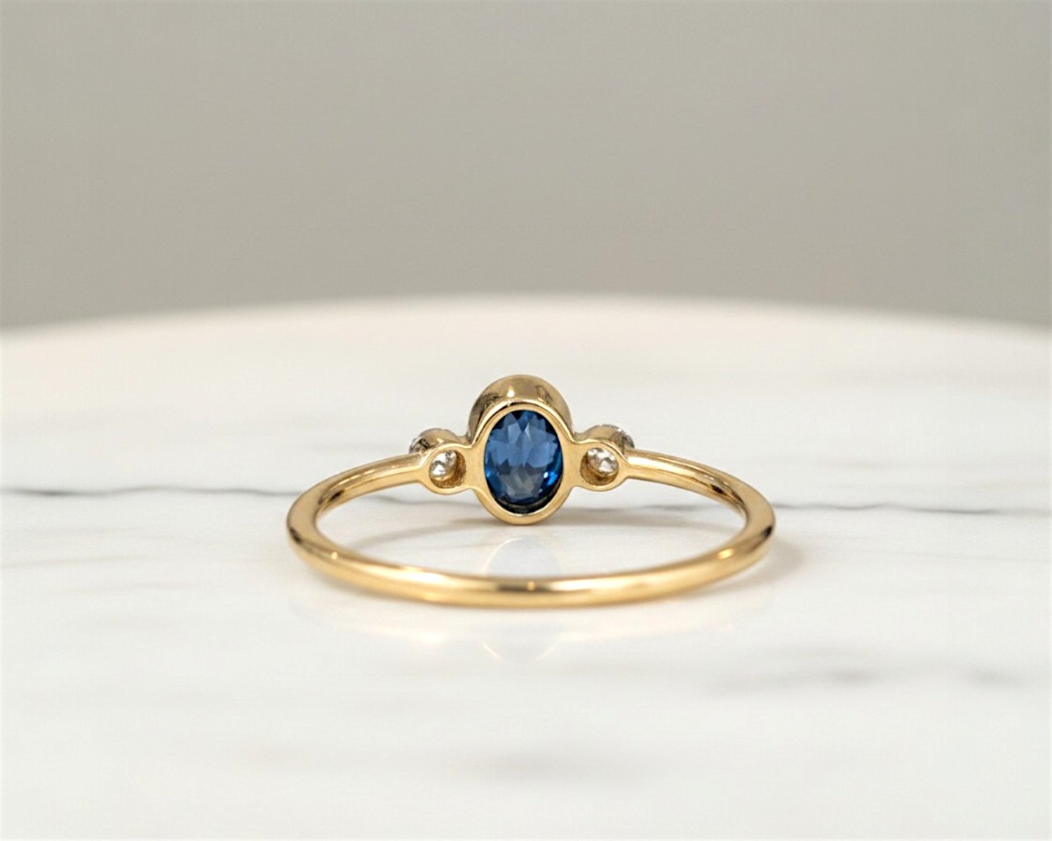 sapphire bezel set ring rear view
