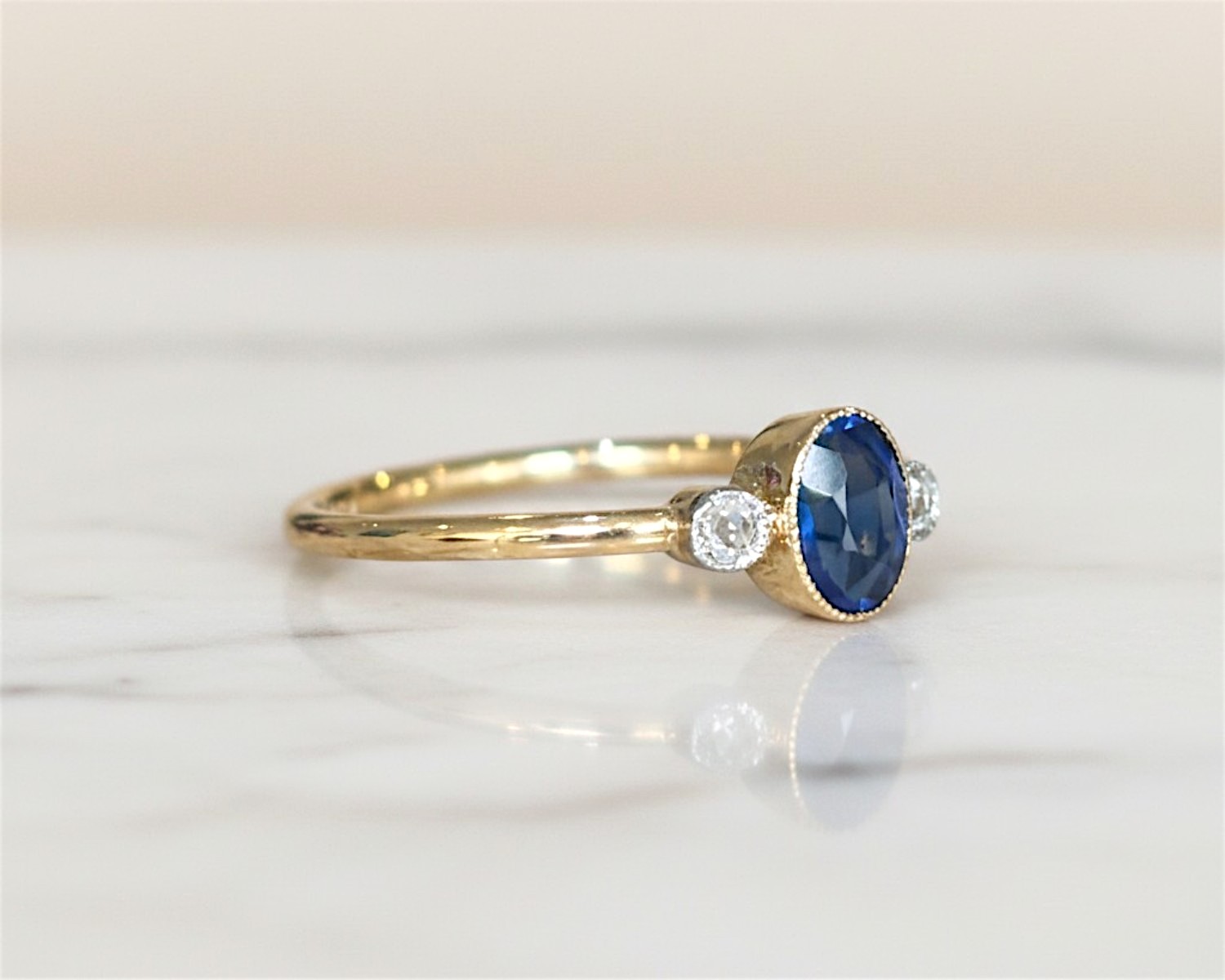 sapphire bezel set ring side view