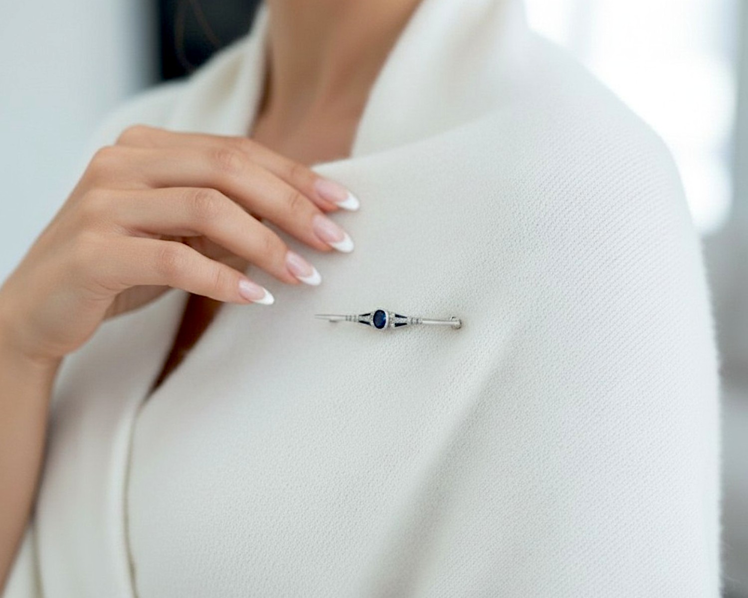 sapphire diamond brooch on model