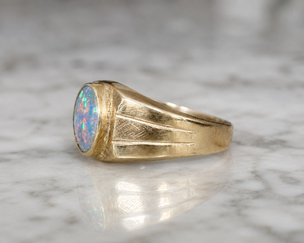 antique 1930s opal signet ring for a man or a woman in 9ct gold for sale in Leeds, showing side profile of the ring
