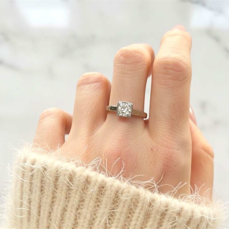 Art Deco 1930s diamond solitaire ring in an 18ct white gold setting with 0.75ct diamond for sale in Leeds, UK, shown on a model's hand