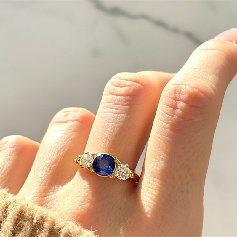 Victorian old cut diamond and blue paste ring in 18ct yellow gold for sale in Leeds, UK on model's hand