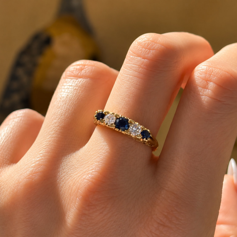 vintage sapphire and diamond five stone ring in 18ct yellow gold for sale in Leeds shown on model's hand
