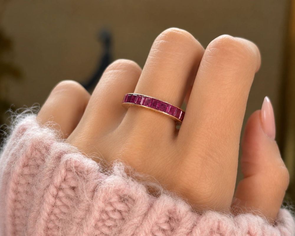 art deco 14ct rose gold ruby full eternity ring for sale in Leeds shown on hand