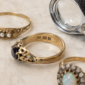antique rings and a jeweller's eye glass