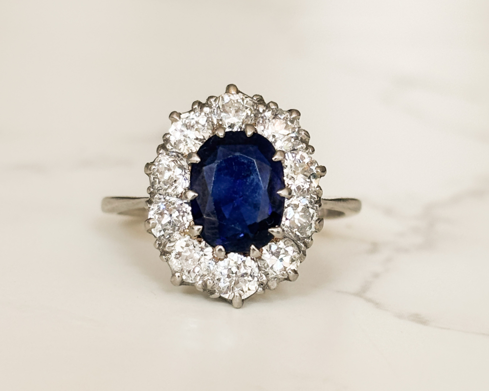 Antique Edwardian sapphire and diamond cluster ring in platinum for sale in Leeds