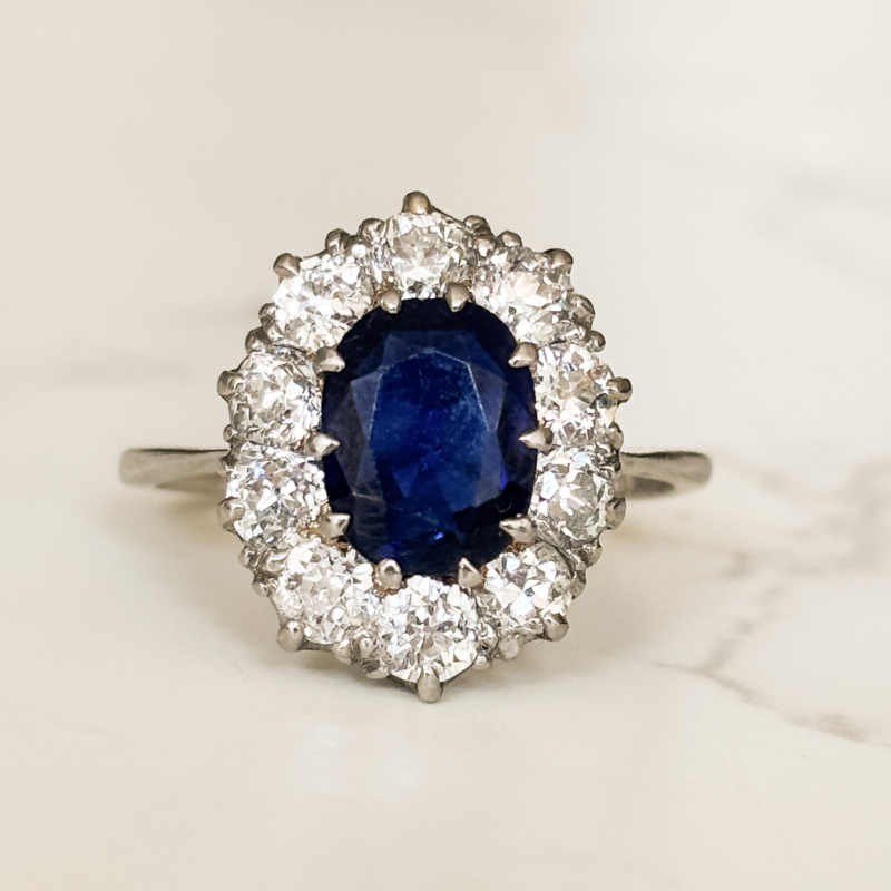 Antique Edwardian sapphire and diamond cluster ring in platinum for sale in Leeds
