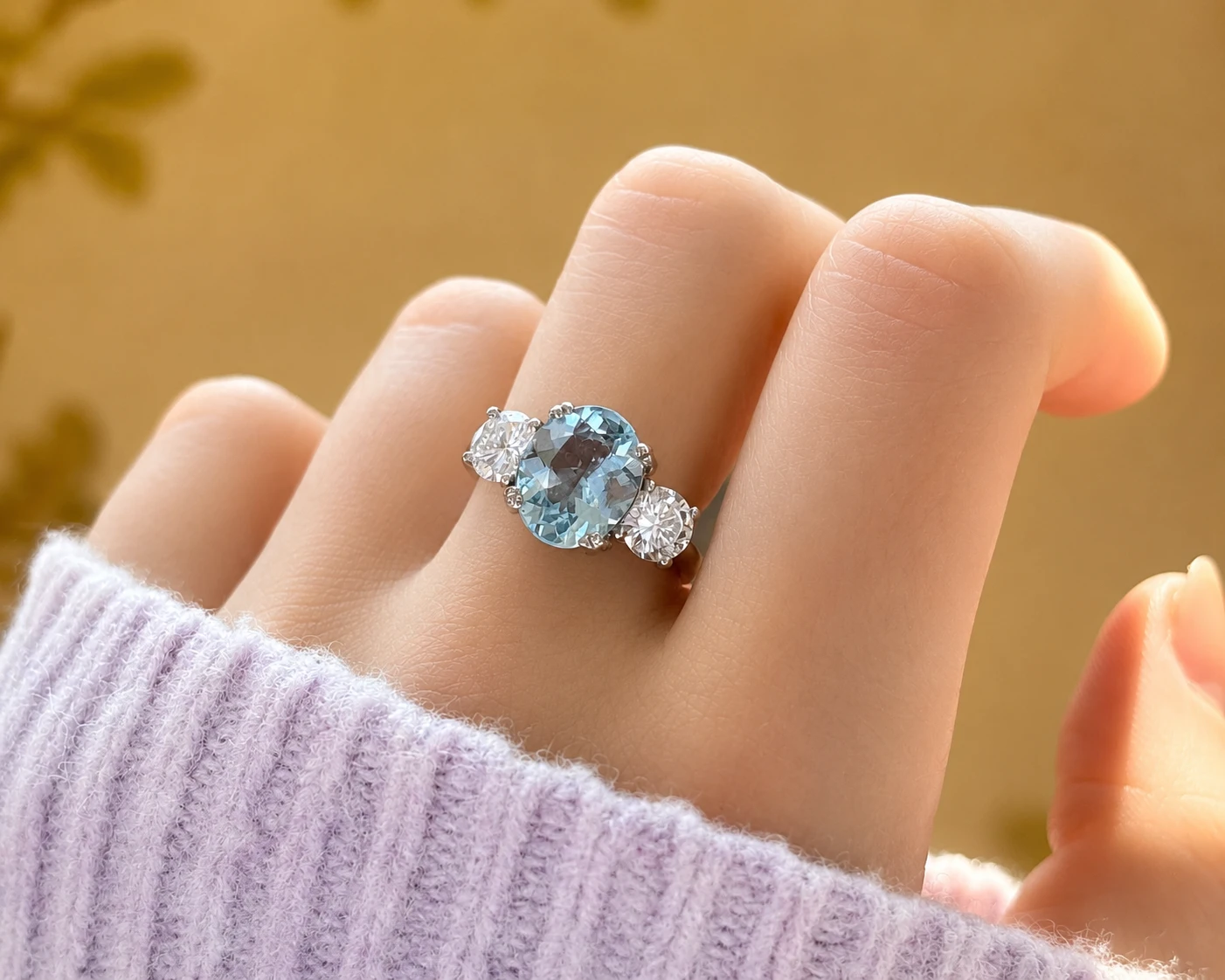 aqua trilogy ring on hand