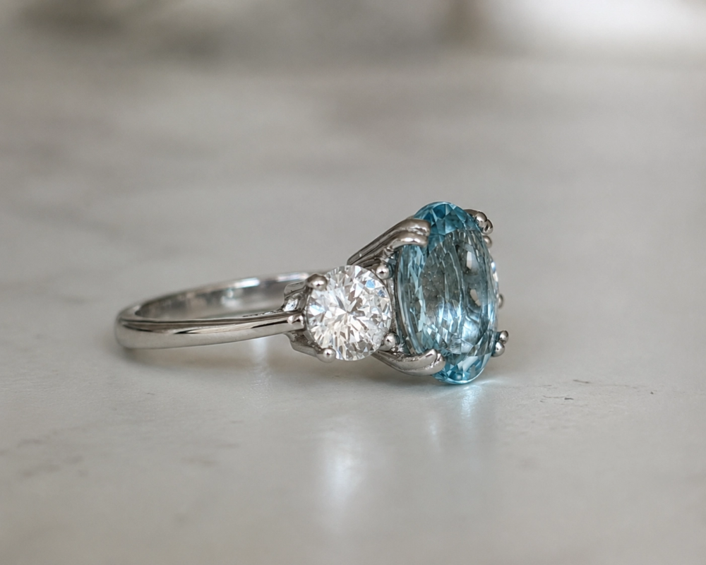 Vintage style aquamarine and diamond three stone ring for sale in Leeds showing side view