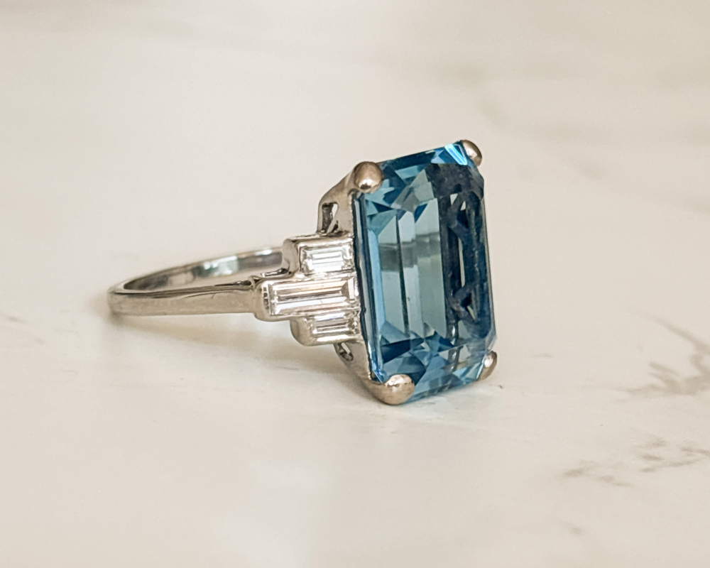 Art Deco aquamarine ring with baguette diamond shoulders for sale in Leeds. Showing the side profile of the ring