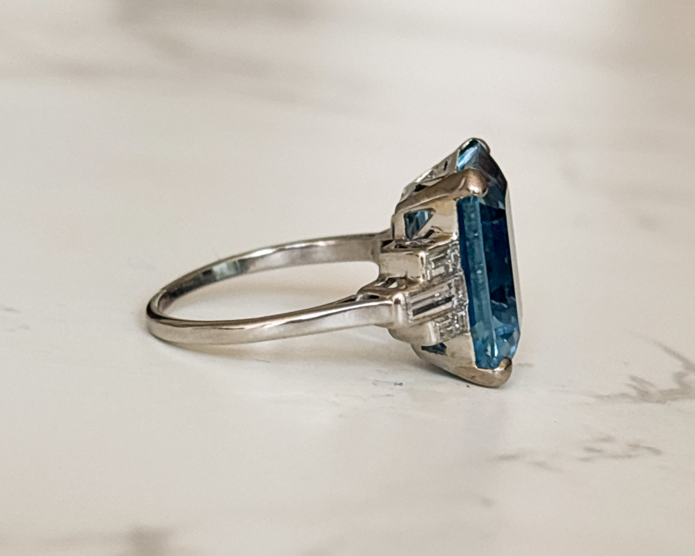 Art Deco aquamarine ring with baguette diamond shoulders for sale in Leeds. Showing the side profile of the ring