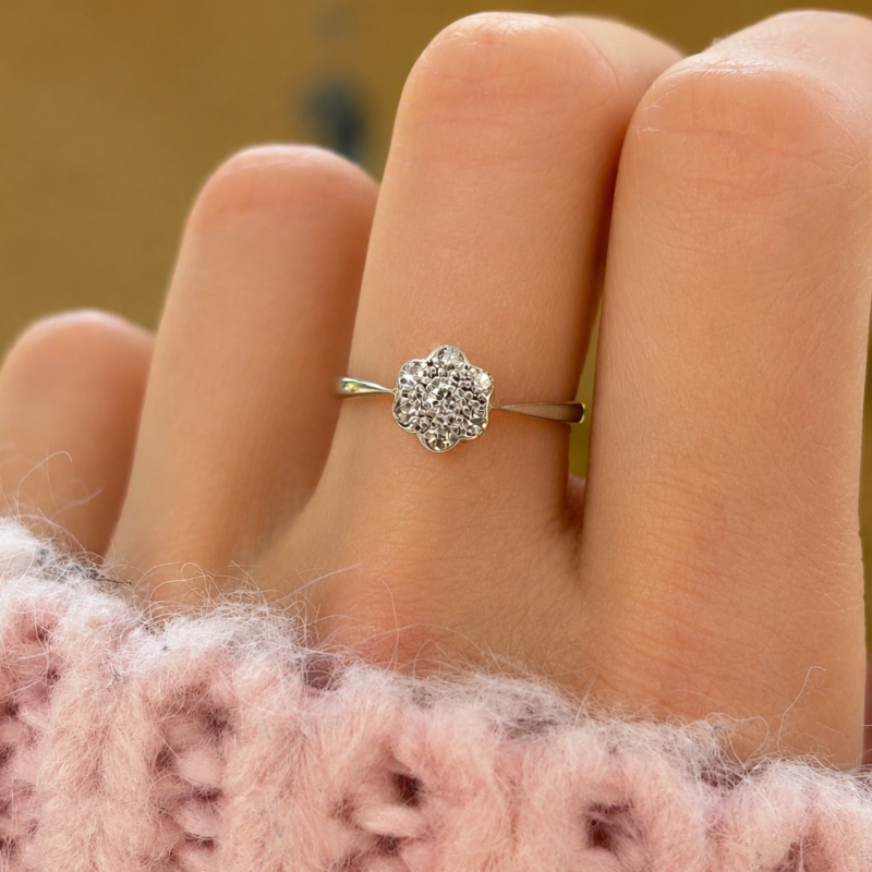 art deco diamond daisy cluster ring in 18ct gold and platinum for sale in leeds shown on hand