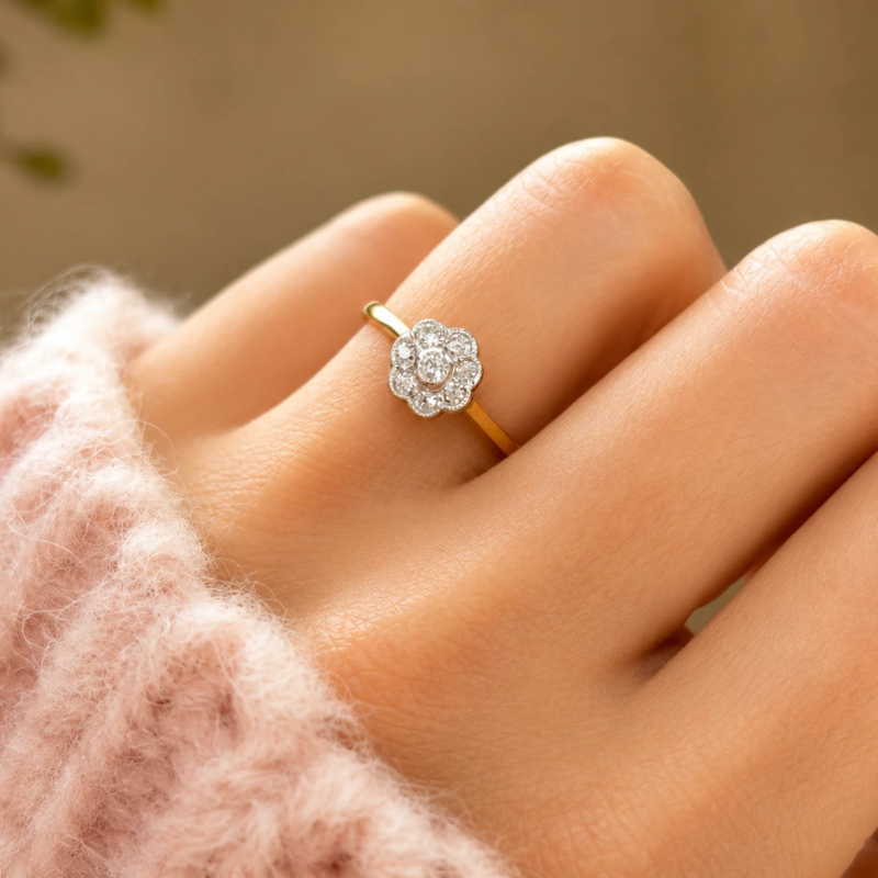 antique diamond daisy ring with old cut diamonds in 18ct gold and platinum for sale in Leeds on women's hand