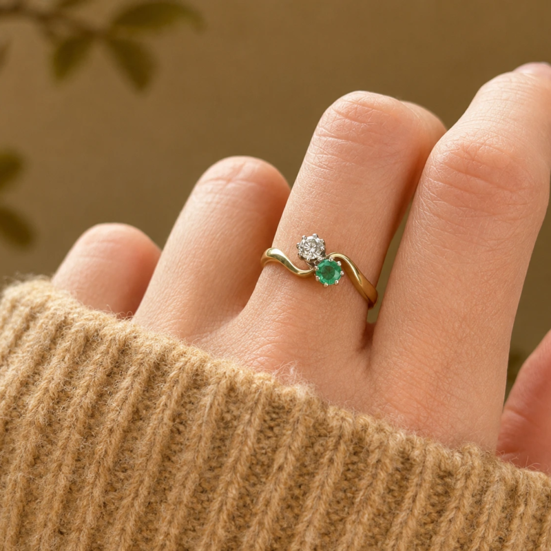 vintage emerald and diamond toi et moi ring for sale in Leeds shown on hand