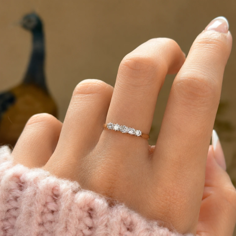 antique 1930s diamond five stone ring in 18ct yellow gold and platinum for sale in Leeds on model's hand