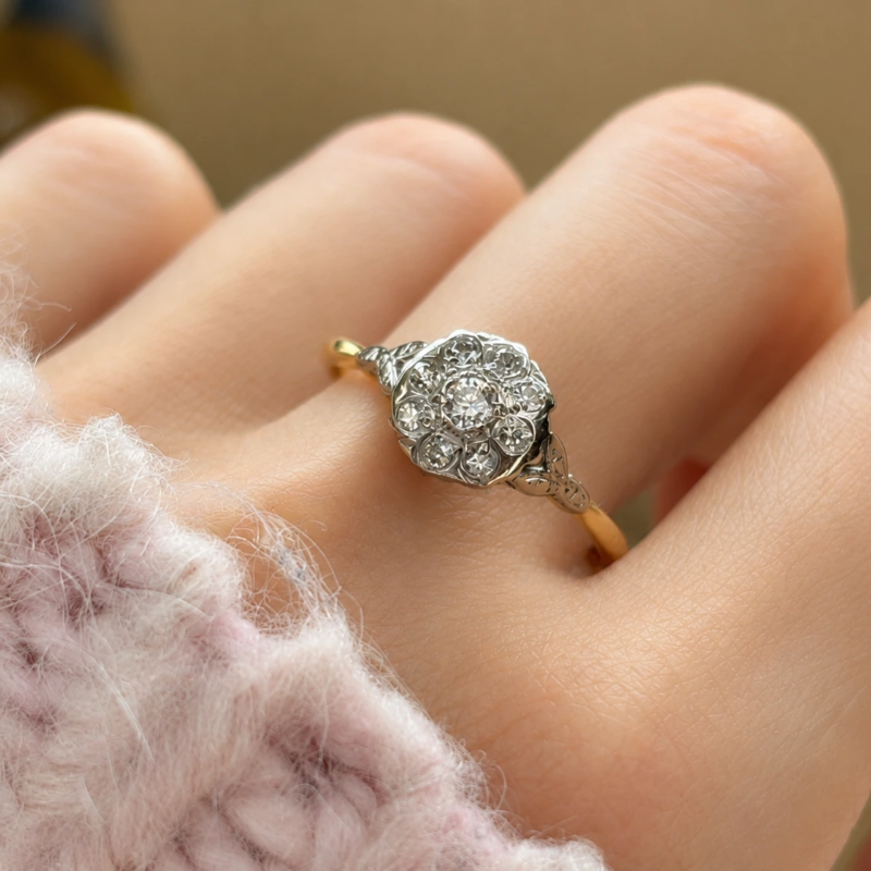 antique 1930s diamond cluster ring in 18ct yellow gold and platinum for sale in Leeds, shown on woman's hand