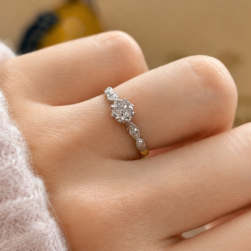 art deco illusion set diamond solitaire in 18ct yellow gold and platinum for sale in Leeds on hand