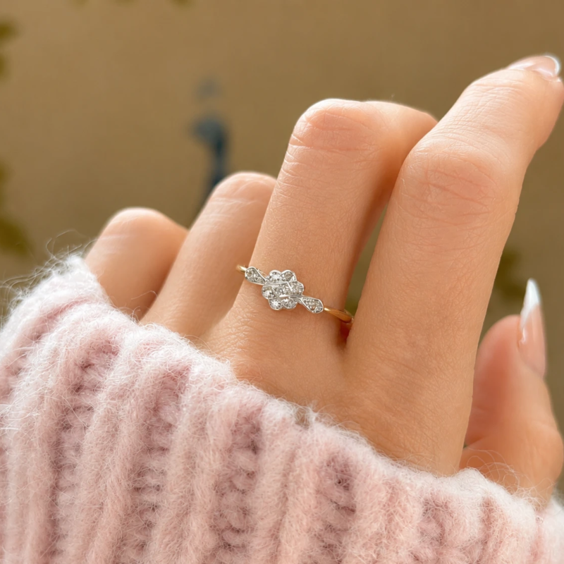 antique Art Deco 1930s diamond daisy cluster ring for sale in Leeds shown on a woman's hand