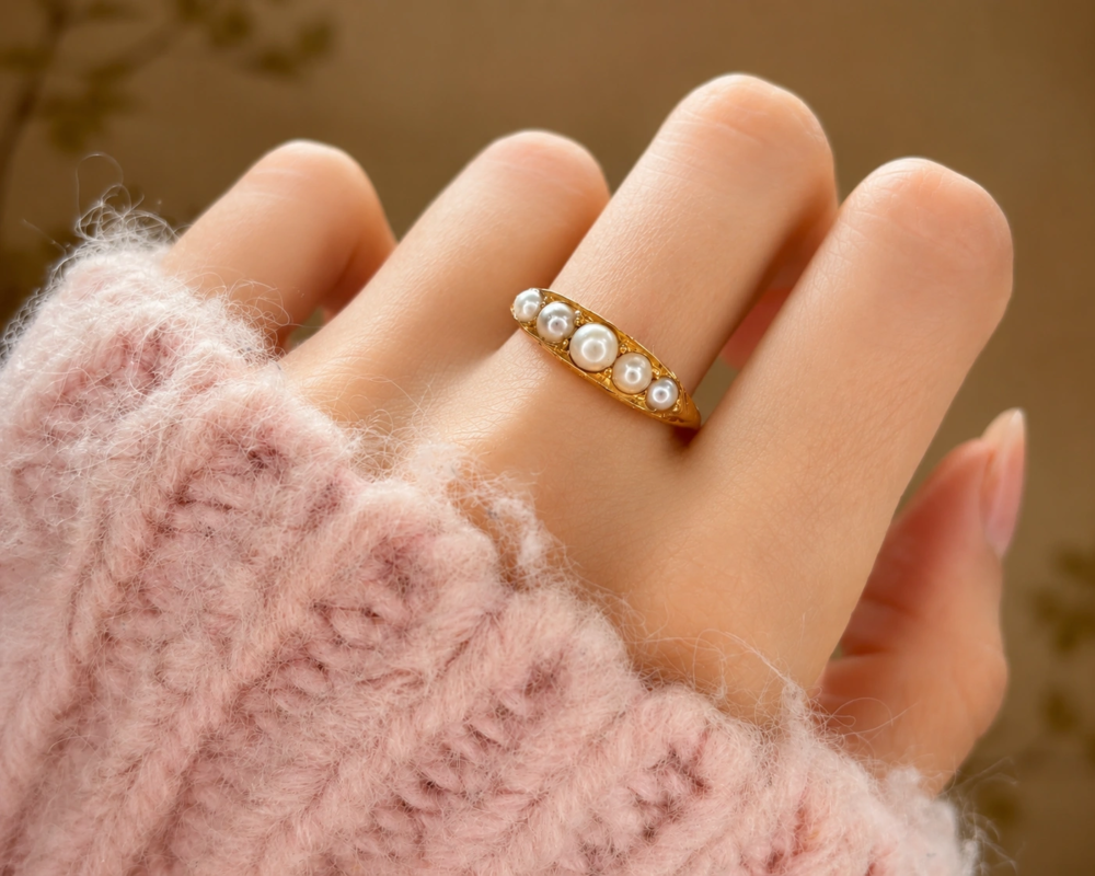 Victorian seed pearl half hoop ring in 18ct gold dated 1899. For sale in Leeds shown on a model's hand
